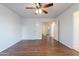 Bedroom with double doors opening to hallway and a ceiling fan at 6410 S Kimberlee Way, Chandler, AZ 85249