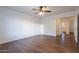 Bright bedroom with wood-look floors and ceiling fan at 6410 S Kimberlee Way, Chandler, AZ 85249