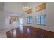 Spacious dining area with hardwood floors, high ceilings, and a chandelier at 6410 S Kimberlee Way, Chandler, AZ 85249