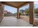 Covered patio with view of pool and backyard at 9202 W Cambridge Ave, Phoenix, AZ 85037