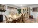 Casual dining area with table and chairs, adjacent to sliding glass doors leading to the backyard at 12425 W Willow Ave, El Mirage, AZ 85335