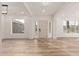 Bright and airy entryway with wood-look floors and neutral walls at 14426 W Gunsight Dr, Sun City West, AZ 85375