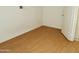 Comfortable bedroom featuring bright walls and durable hardwood floors at 4901 S Calle Los Cerros Dr # 202, Tempe, AZ 85282
