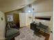 Cozy bedroom with a workspace including a desk, chair, and laptop in front of a window at 4901 S Calle Los Cerros Dr # 202, Tempe, AZ 85282