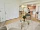 Bright living room with sleek furnishings, light wood flooring, and access to a modern kitchen at 4901 S Calle Los Cerros Dr # 202, Tempe, AZ 85282