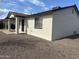 A low angle view of the property shows brick detailing and a small window under the roof's edge at 5255 S Mill Ave, Tempe, AZ 85283