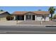 Inviting single-story home with a well-maintained front yard, neutral tones, and an attached carport at 5255 S Mill Ave, Tempe, AZ 85283