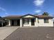 A charming residence with a well-kept front yard and an open carport at 5255 S Mill Ave, Tempe, AZ 85283