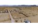 Aerial view of a mobile home on a large desert lot, with distant mountain views at 53275 W Adele Rd, Maricopa, AZ 85139