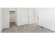 Bright bedroom with carpet flooring and a spacious closet at 53275 W Adele Rd, Maricopa, AZ 85139