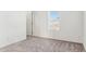 Simple bedroom with neutral walls, carpet, and window coverings at 53275 W Adele Rd, Maricopa, AZ 85139