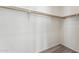 Large closet with wood closet rod and neutral carpeting at 53275 W Adele Rd, Maricopa, AZ 85139