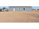 Gray house on a large lot with desert landscape at 53275 W Adele Rd, Maricopa, AZ 85139