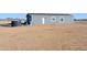 Gray house on a large lot with desert landscape at 53275 W Adele Rd, Maricopa, AZ 85139