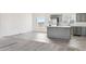 Modern kitchen with gray cabinets and stainless steel appliances at 53275 W Adele Rd, Maricopa, AZ 85139