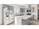 Modern kitchen with gray cabinets, stainless steel appliances, and an island at 53275 W Adele Rd, Maricopa, AZ 85139