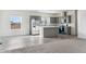 Modern kitchen with gray cabinets, stainless steel appliances, and an island at 53275 W Adele Rd, Maricopa, AZ 85139