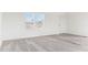Bright living room with neutral carpet and large windows at 53275 W Adele Rd, Maricopa, AZ 85139