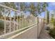 White vinyl fence separating the backyard from community amenities at 5951 E Trailridge St, Mesa, AZ 85215