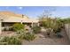 Landscaped backyard with desert plants and patio at 5951 E Trailridge St, Mesa, AZ 85215