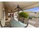 Covered patio with seating area and glass-top table at 5951 E Trailridge St, Mesa, AZ 85215