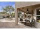 Relaxing covered patio with seating and ceiling fans at 5951 E Trailridge St, Mesa, AZ 85215