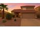 Inviting two-story home with a terracotta tile roof and desert landscaping at 5951 E Trailridge St, Mesa, AZ 85215