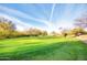 Golf course putting green with American flag at 5951 E Trailridge St, Mesa, AZ 85215