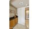 Hallway featuring granite counters, cabinets, and access to the main floor at 5951 E Trailridge St, Mesa, AZ 85215