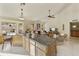 Bright, open-concept kitchen island with granite countertop overlooking the living area at 5951 E Trailridge St, Mesa, AZ 85215