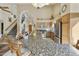 Spacious kitchen features a large granite island, stainless steel appliances, and wooden cabinetry at 5951 E Trailridge St, Mesa, AZ 85215