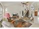 Inviting living area with a fireplace, comfortable seating, and an open flow to the kitchen at 5951 E Trailridge St, Mesa, AZ 85215