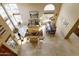 Open living and dining area with travertine floors, lots of natural light and neutral decor at 5951 E Trailridge St, Mesa, AZ 85215