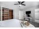 Serene bedroom with wood-paneled closet and desk at 8243 E Rancho Vista Dr, Scottsdale, AZ 85251