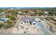 Aerial view of a modern home with desert landscaping and a paver driveway against a mountain backdrop at 8714 E Tether Trl, Scottsdale, AZ 85255