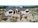 Exterior of a modern home showcasing desert landscaping, and a paver driveway at 8714 E Tether Trl, Scottsdale, AZ 85255