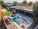 Aerial view of the home and backyard with a large pool at 100 W Sparrow Dr, Chandler, AZ 85286