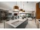 Modern kitchen island with cooktop and wine storage visible at 10040 E Happy Valley Rd # 446, Scottsdale, AZ 85255