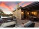 Relaxing backyard oasis with a hot tub, patio furniture, and sunset views at 11714 N 134Th St, Scottsdale, AZ 85259
