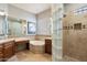 Spa-like bathroom with a soaking tub, walk-in shower, and double vanity at 11714 N 134Th St, Scottsdale, AZ 85259