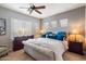 Bright bedroom with a king-size bed, dresser, and stylish lamps at 11714 N 134Th St, Scottsdale, AZ 85259