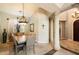 Elegant dining room featuring a large wooden table and high ceilings at 11714 N 134Th St, Scottsdale, AZ 85259