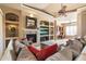 Comfortable living room with a fireplace and built-in entertainment center at 11714 N 134Th St, Scottsdale, AZ 85259
