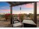 Cozy patio with fire pit and seating, offering scenic views at 11714 N 134Th St, Scottsdale, AZ 85259