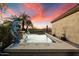 Stunning pool and spa with dolphin statues and sunset views at 11714 N 134Th St, Scottsdale, AZ 85259