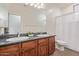 Bathroom featuring dual sinks and a shower/tub combo at 1231 W Hawken Way, Chandler, AZ 85286