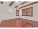 Bedroom featuring exposed beams on the ceiling and a ceiling fan at 1231 W Hawken Way, Chandler, AZ 85286