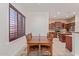 Dining area with a wood table and direct access to the kitchen at 1231 W Hawken Way, Chandler, AZ 85286