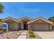 Charming single-story home featuring a low maintenance front yard and a two-car garage at 1231 W Hawken Way, Chandler, AZ 85286