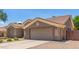 View of the two-car garage and low maintenance front yard at 1231 W Hawken Way, Chandler, AZ 85286
